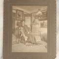 Lot 120 - Antique Boarded Photo Of A Young Man College Student, Likely In A Dorm Room, With Interior Scene Including Artwork, Early Light Fixture, Dresser, Pennant, Fur Rug, And More