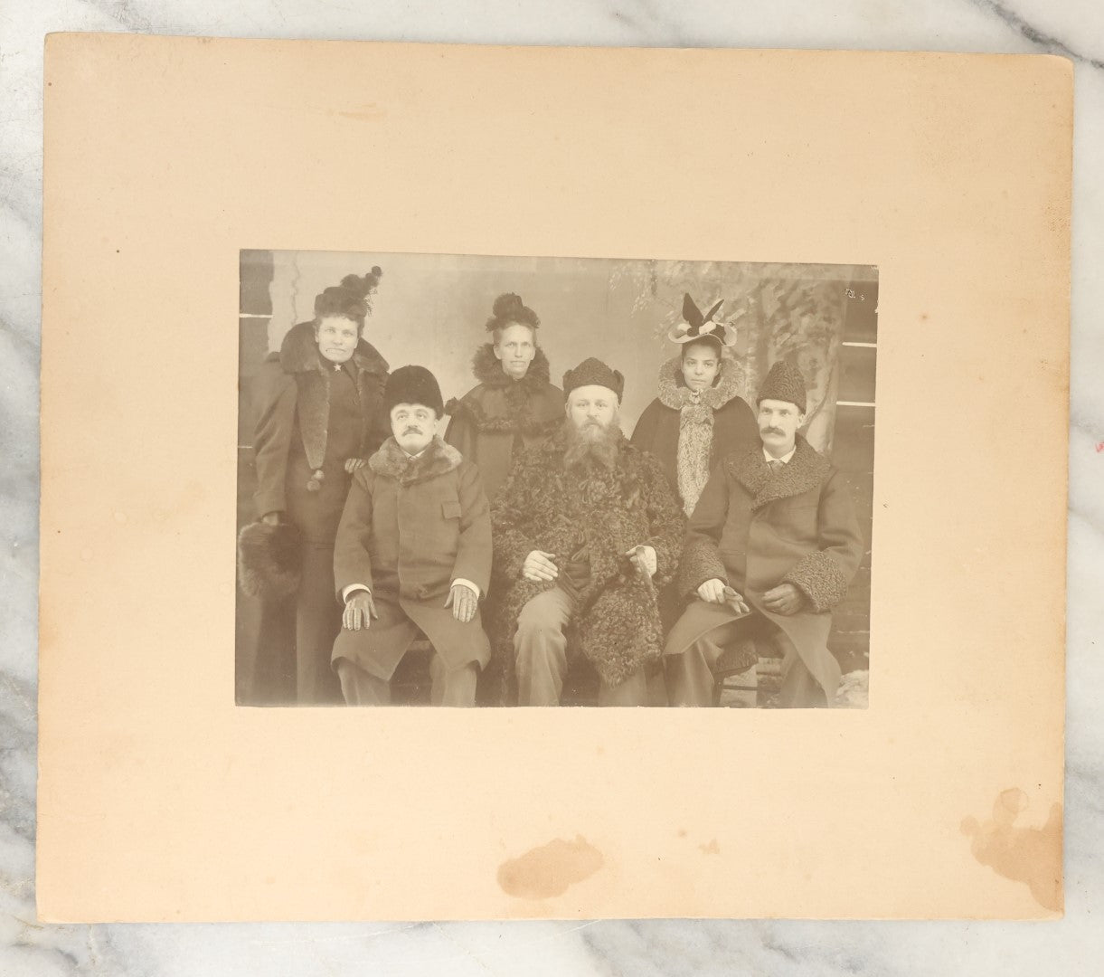 Lot 127 - Antique Boarded Group Photo Of Three Men And Three Women In Heavy Fur Lined Coats And Hats, Possibly Russian, Eastern European