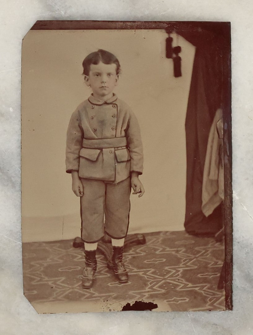 Lot 131 - Grouping Of Seven Antique Tintype Photographs Of Babies And Children, Including Smiling Baby With Tinted Yellow Waist Ribbon, Toddler In Winter Clothes With Gloves, And More