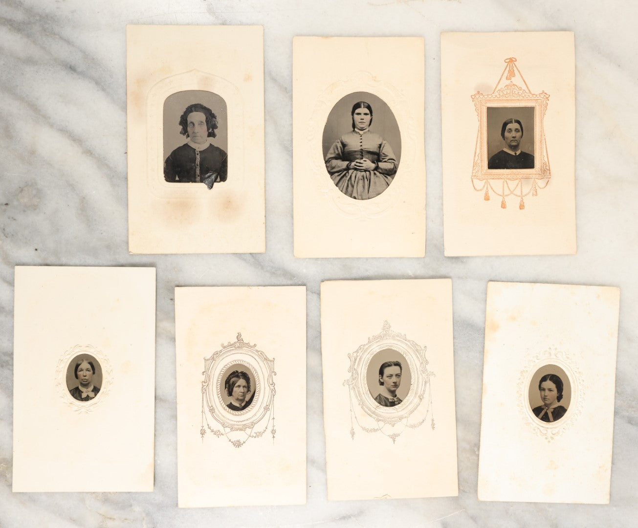 Lot 134 - Grouping Of Seven Antique Gem Size Tintype Photographs In Paper Mats Of Women, Including Young Women, Elderly Women, And Others