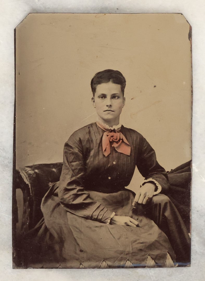 Lot 135 - Grouping Of Six Antique Tintype Photographs Of Pretty Young Women, Including Smiling Woman With Tinted Bow Holding Photo Album