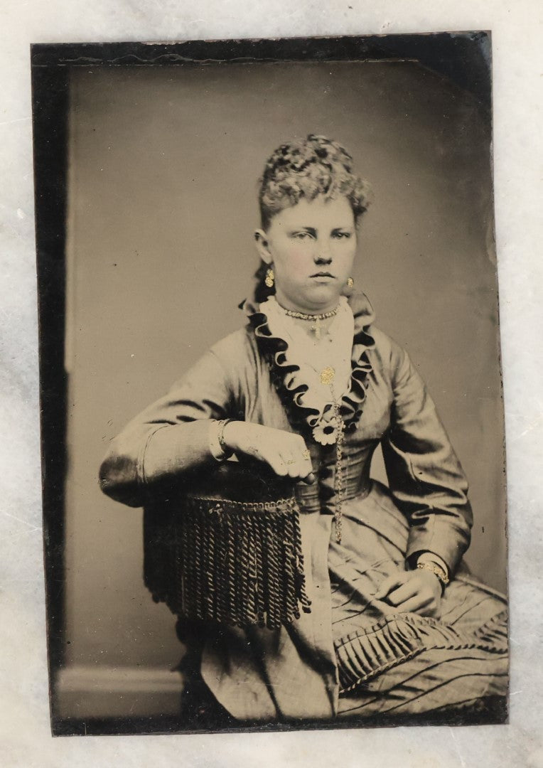 Lot 135 - Grouping Of Six Antique Tintype Photographs Of Pretty Young Women, Including Smiling Woman With Tinted Bow Holding Photo Album
