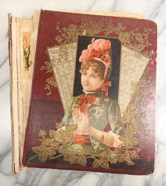 Lot 155 - Antique Victorian Scrapbook Album With Woman On Cover Containing 175+ Pieces Including Die Cuts, Trade Cards, Calling Cards, And More, With Woman On Cover, Note Cover Detached