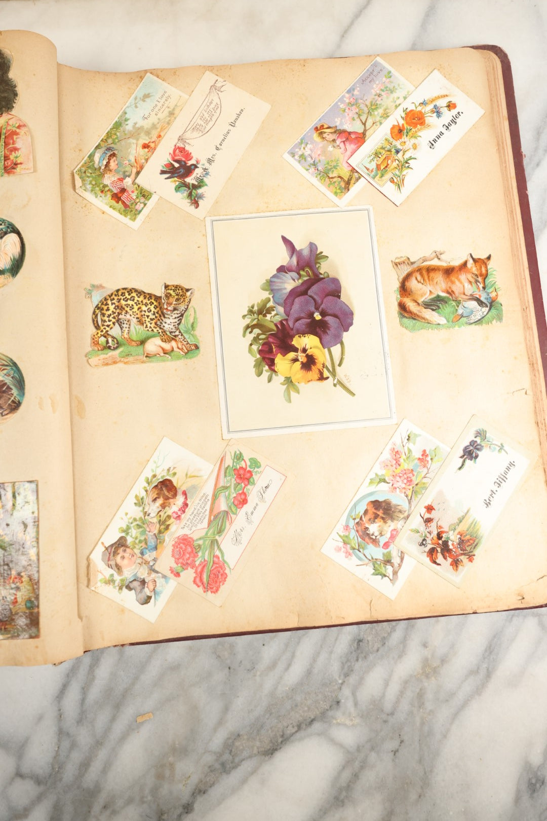 Lot 155 - Antique Victorian Scrapbook Album With Woman On Cover Containing 175+ Pieces Including Die Cuts, Trade Cards, Calling Cards, And More, With Woman On Cover, Note Cover Detached