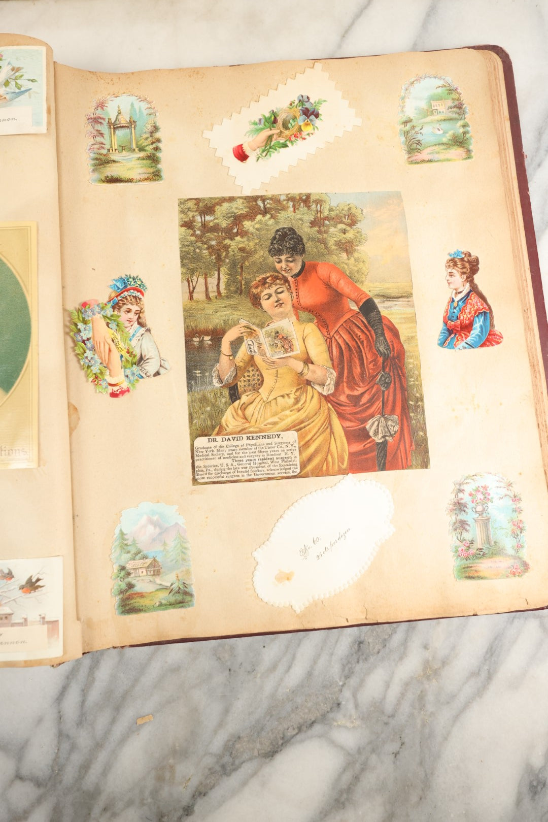 Lot 155 - Antique Victorian Scrapbook Album With Woman On Cover Containing 175+ Pieces Including Die Cuts, Trade Cards, Calling Cards, And More, With Woman On Cover, Note Cover Detached