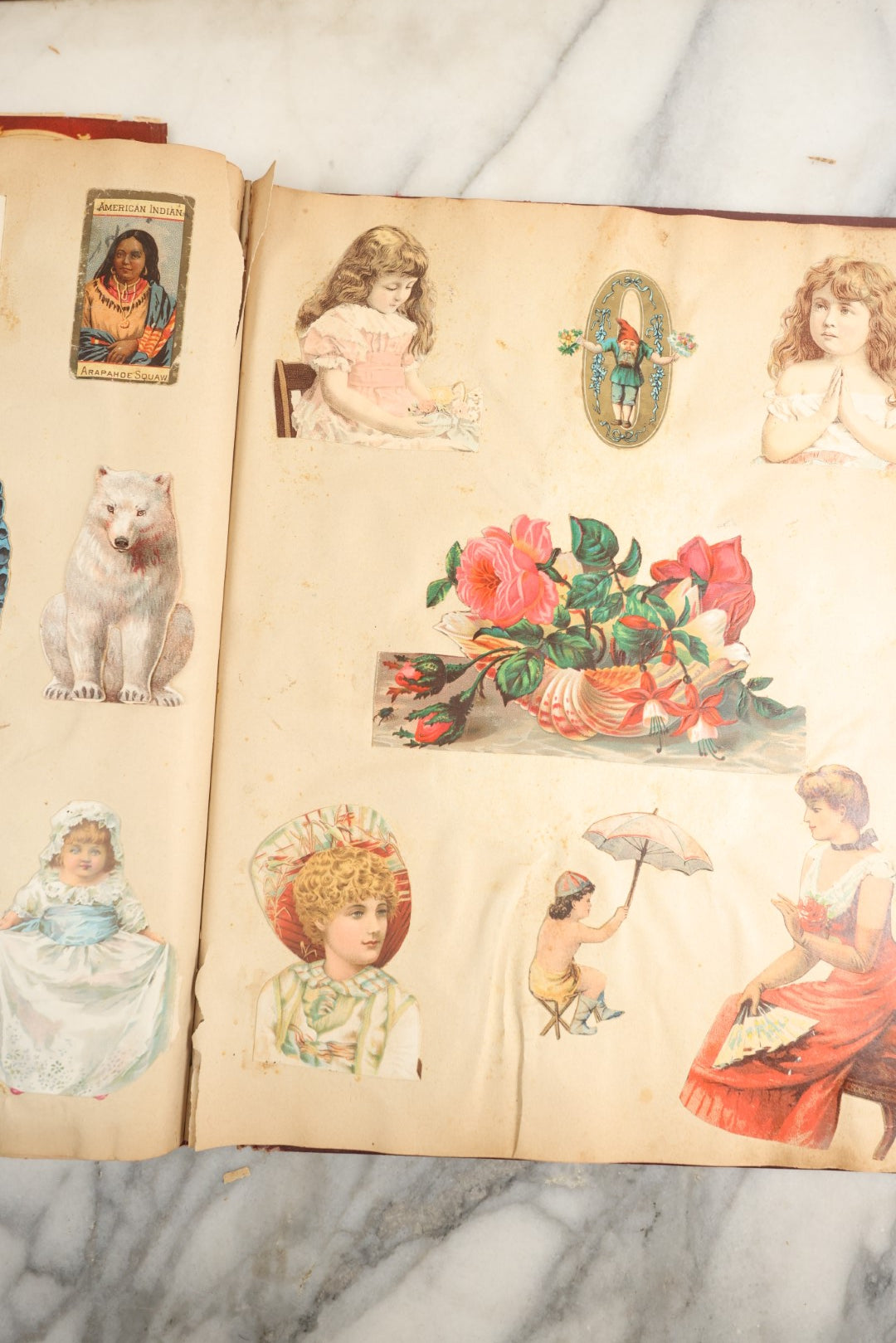 Lot 155 - Antique Victorian Scrapbook Album With Woman On Cover Containing 175+ Pieces Including Die Cuts, Trade Cards, Calling Cards, And More, With Woman On Cover, Note Cover Detached