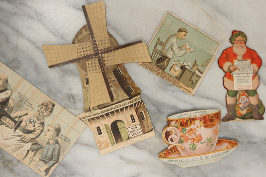 Lot 160 - Grouping Of Five Trade Cards Including Three Transforming Flip Out Cards, A Mechanical Windmill Card, And An Early Santa Die Cut
