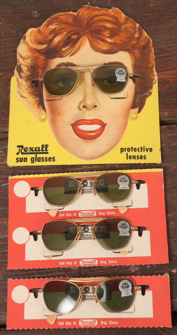 Lot 036 - Vintage Rexall Sunglasses Carded Store Display With Woman's Face, Four Pairs Of New Old Stock N.O.S. Sunglasses With Protective Lenses, Note Separation In Cards