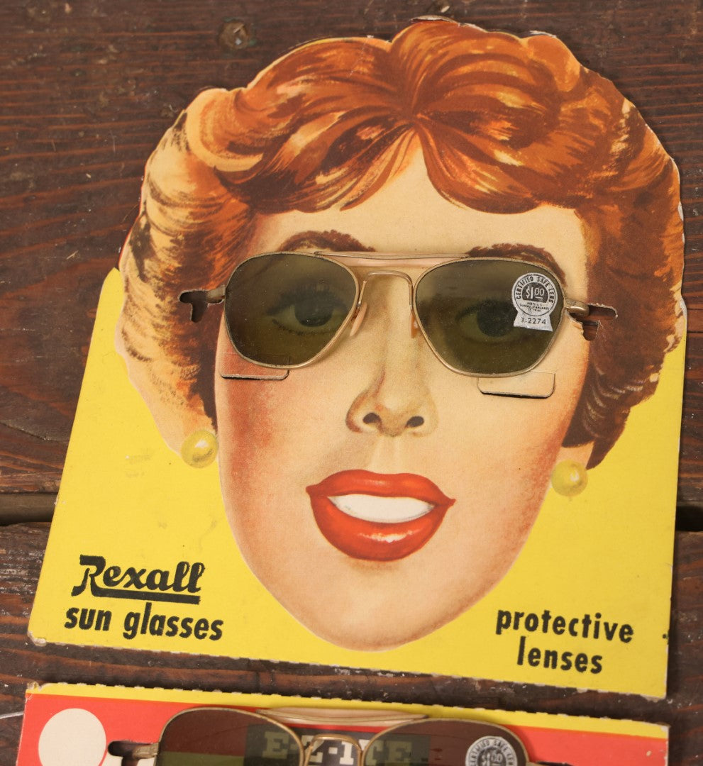 Lot 036 - Vintage Rexall Sunglasses Carded Store Display With Woman's Face, Four Pairs Of New Old Stock N.O.S. Sunglasses With Protective Lenses, Note Separation In Cards