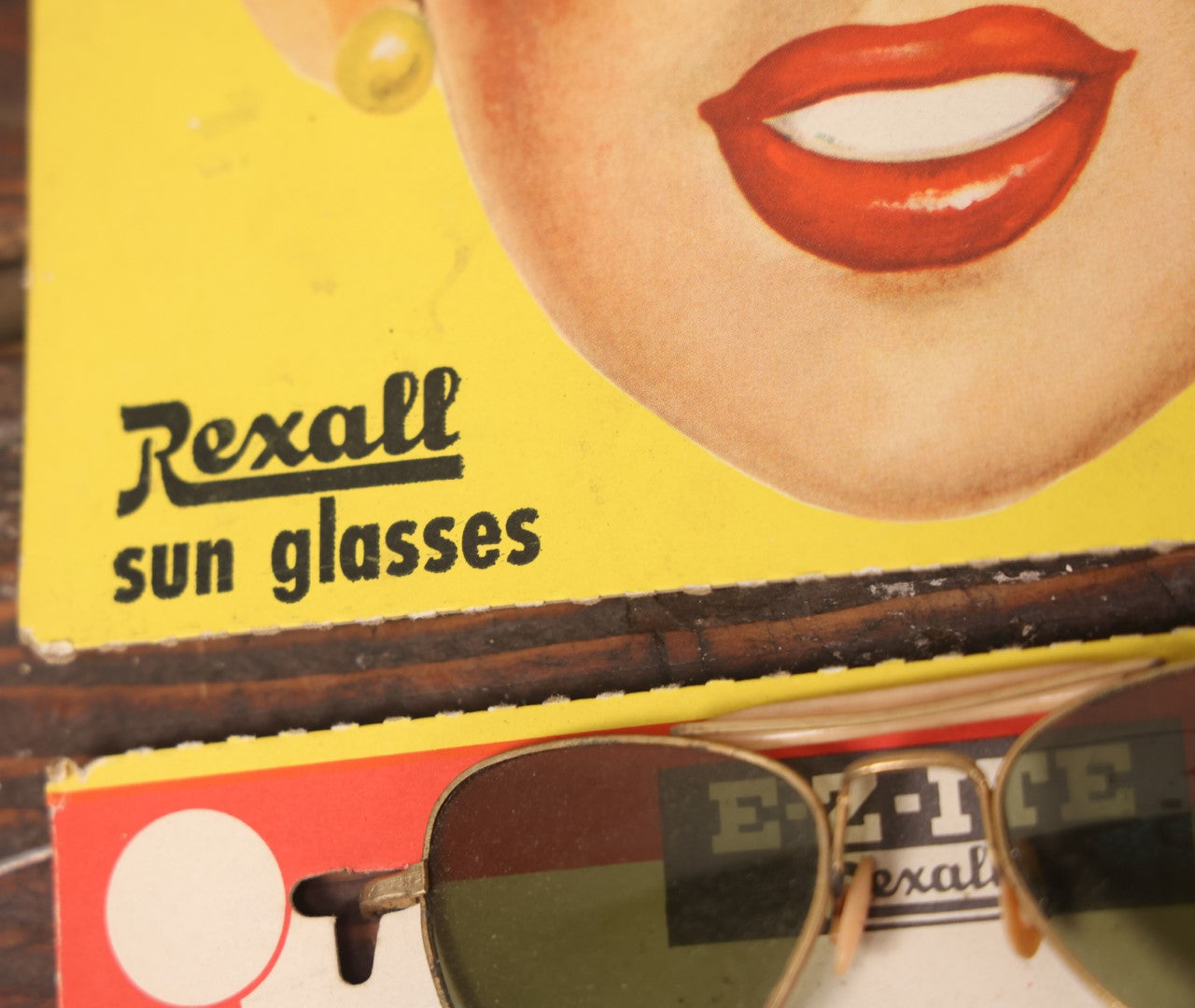 Lot 036 - Vintage Rexall Sunglasses Carded Store Display With Woman's Face, Four Pairs Of New Old Stock N.O.S. Sunglasses With Protective Lenses, Note Separation In Cards