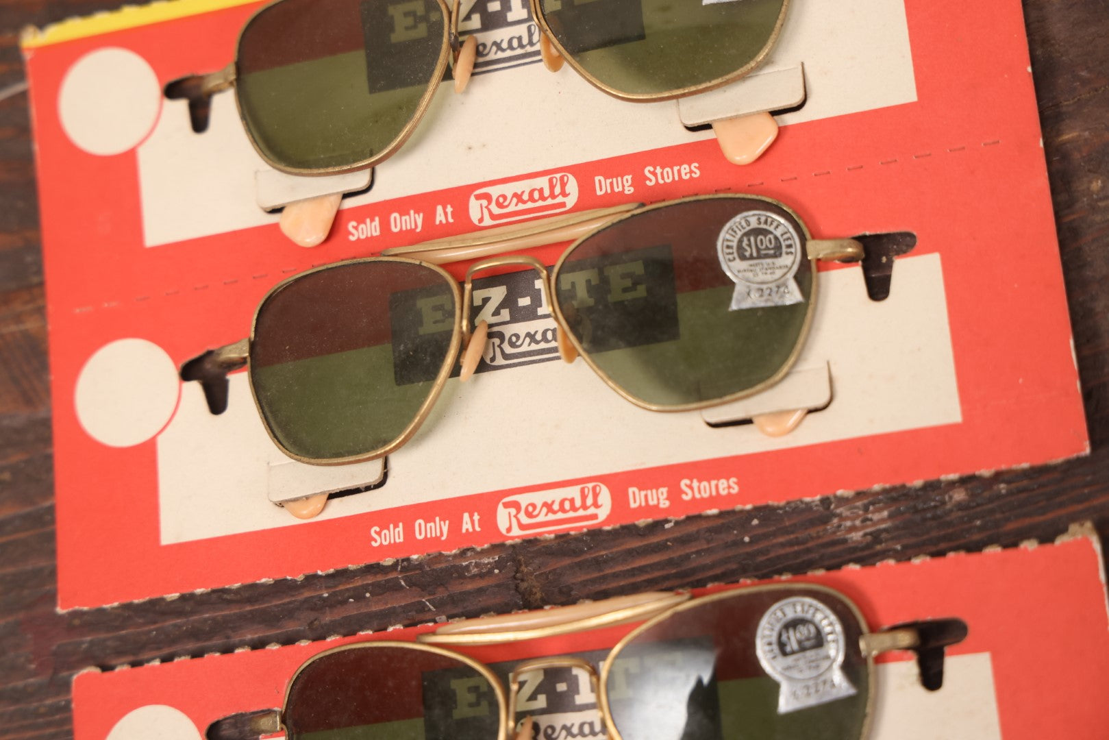 Lot 036 - Vintage Rexall Sunglasses Carded Store Display With Woman's Face, Four Pairs Of New Old Stock N.O.S. Sunglasses With Protective Lenses, Note Separation In Cards