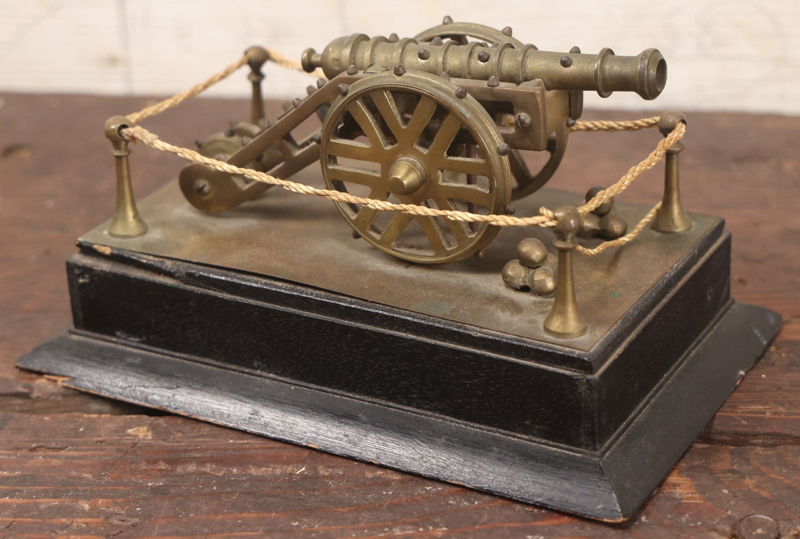 Lot 047 - Vintage Brass Metal Canon Miniature Display On Wooden Base With Rope Surround