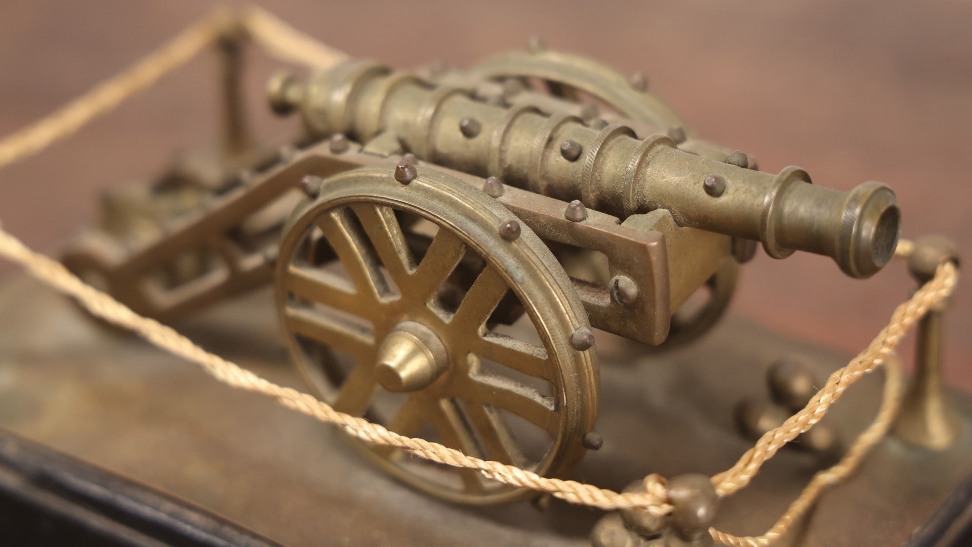 Lot 047 - Vintage Brass Metal Canon Miniature Display On Wooden Base With Rope Surround