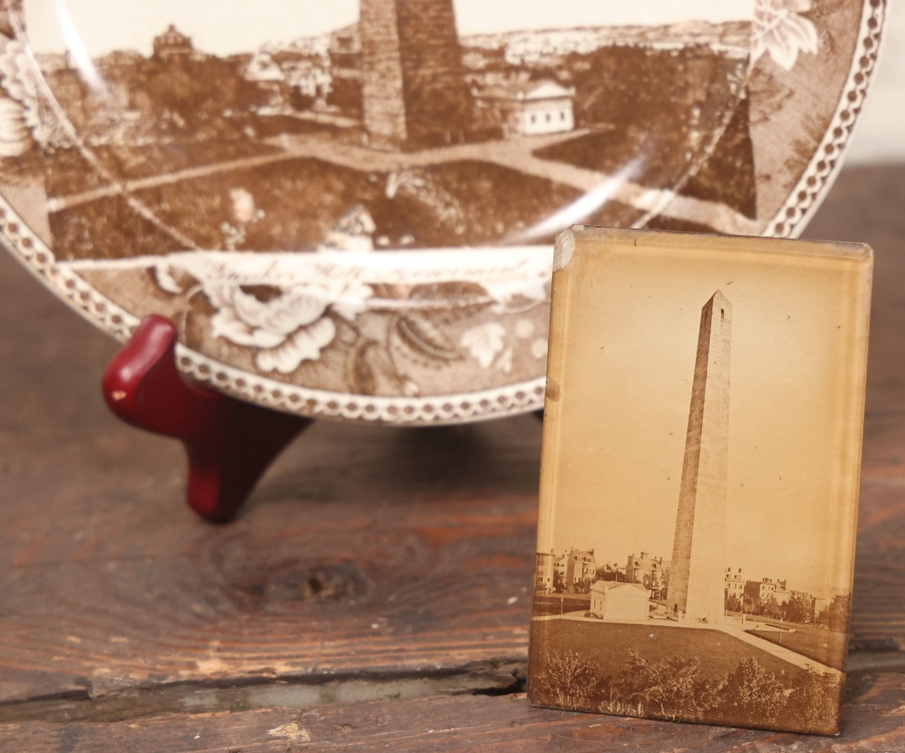 Lot 048 - Pair Of Antique Bunker Hill Monument, Boston, Massachusetts Souvenir Collectibles, Including Transferware Plate And Photograph Mounted To Frame