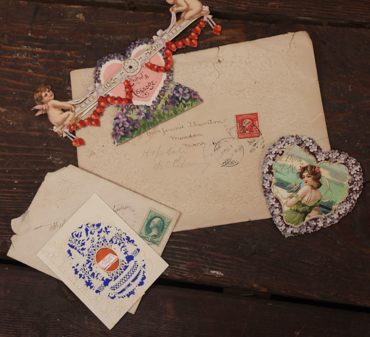 Lot 062 - Grouping Of 3+ Valentines Ephemera With Antique Die Cut Valentines, Including Mechanical Cupid On Seesaw Valentine, And Embossed Envelope