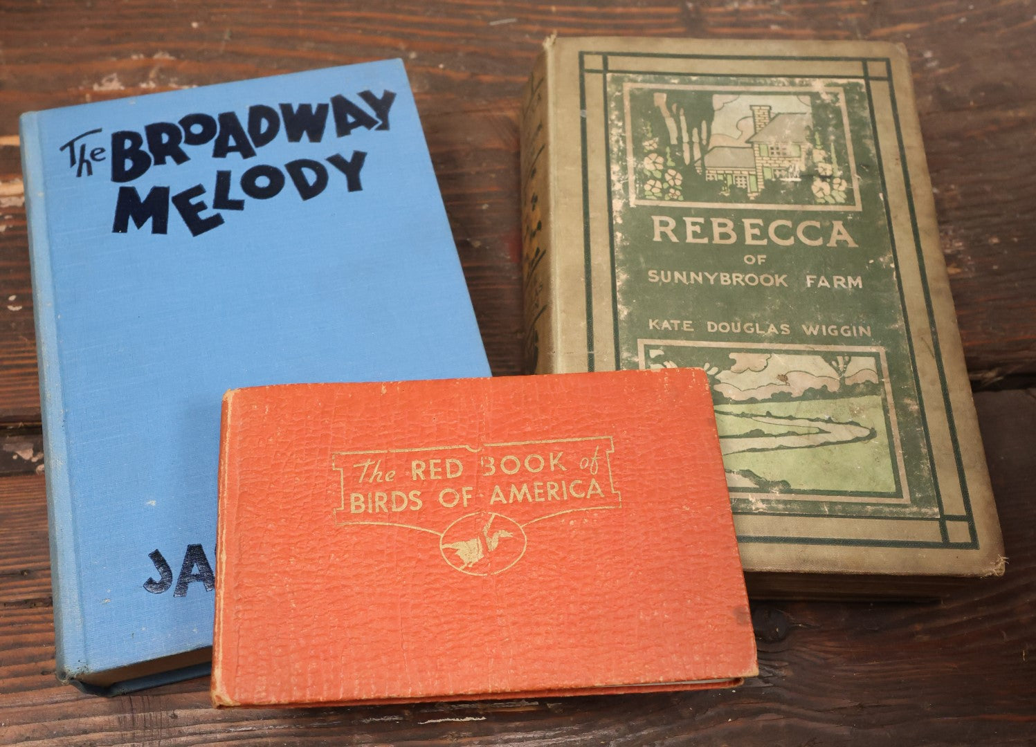 Lot 080 - Grouping Of Three Antique And Vintage Books Including The Broadway Melody, The Red Book Of Birds Of America, And Rebecca Of Sunnybrook Farm