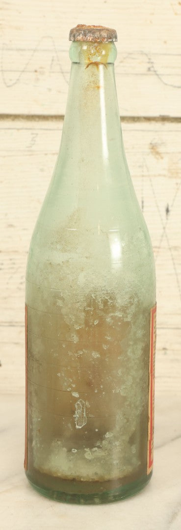 Lot 005 - Antique Pluto Water Glass Bottle With Original Paper Label, Devil Graphics, French Lick Springs Hotel Co., French Lick, Indiana, With Embossed Devil On Bottom, Drilled Cap