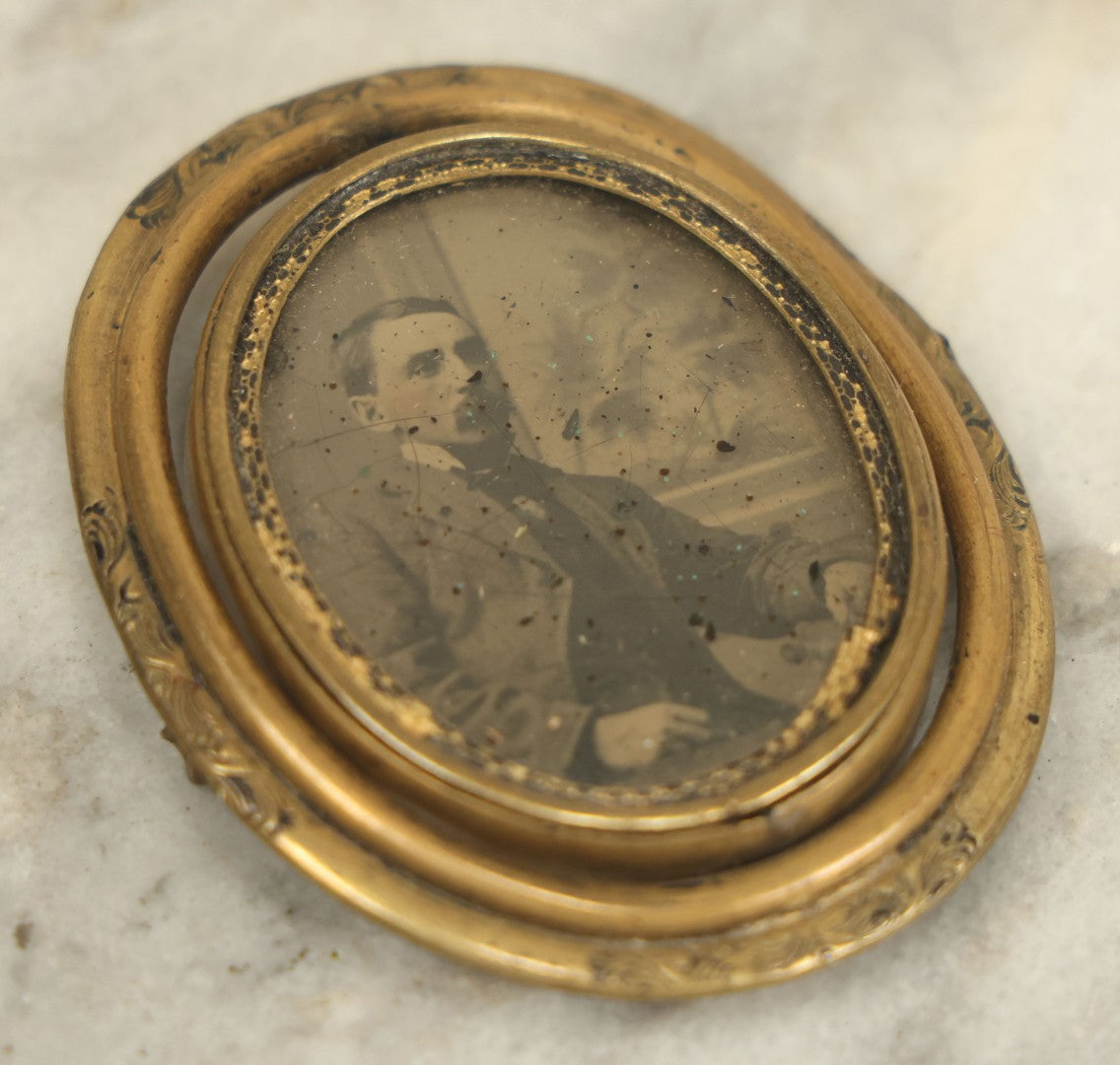 Lot 011 - Antique Brass Swivel Photo Brooch With Tintype And C.D.V. Of Man, Missing Pin, Various Wear