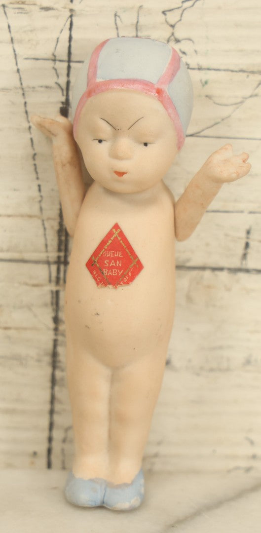 Lot 025 - Vintage Queue San Baby Bisque Doll With Partial Paper Label