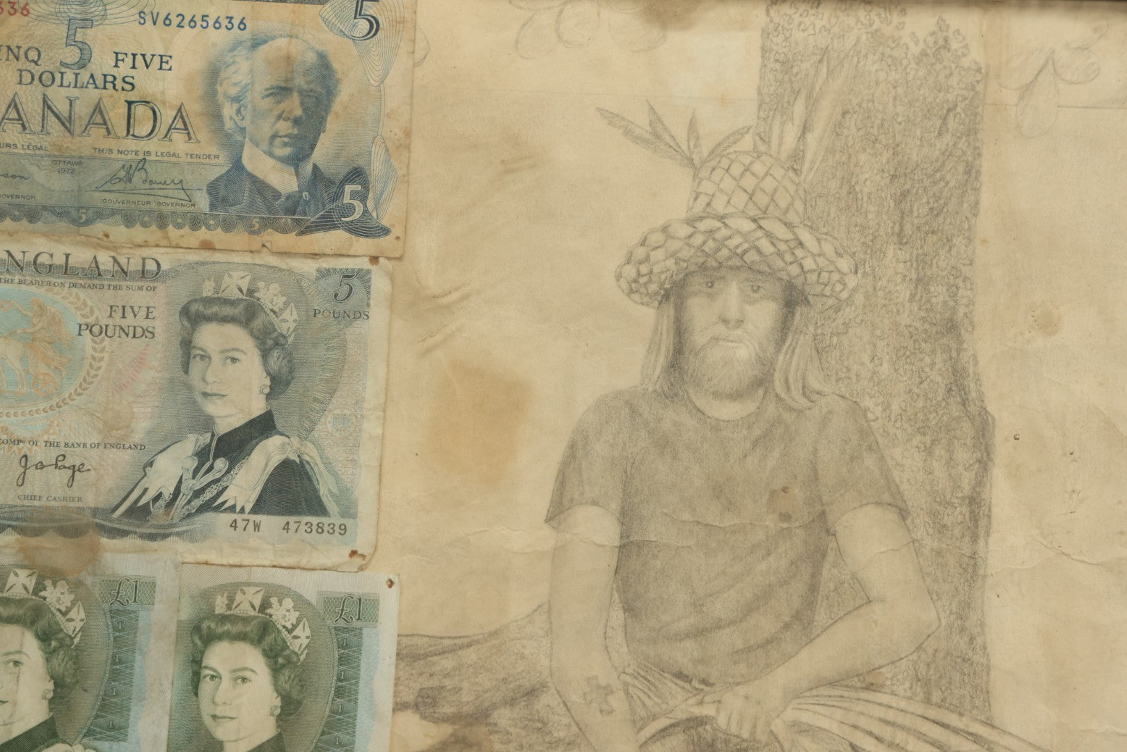 Lot 043 - Vintage Pencil Sketch Folk Art Of Man Weaving Hat With Nine Pieces Of Foreign Currency In Frame From Canada, Vietnam, Etc., Artist Signed And Dated, Illegible