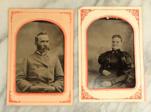 Lot 068 - Pair Of Approximately 1/4 Plate Tintype Photographs Of A Man And A Woman, In Paper Frame Mats