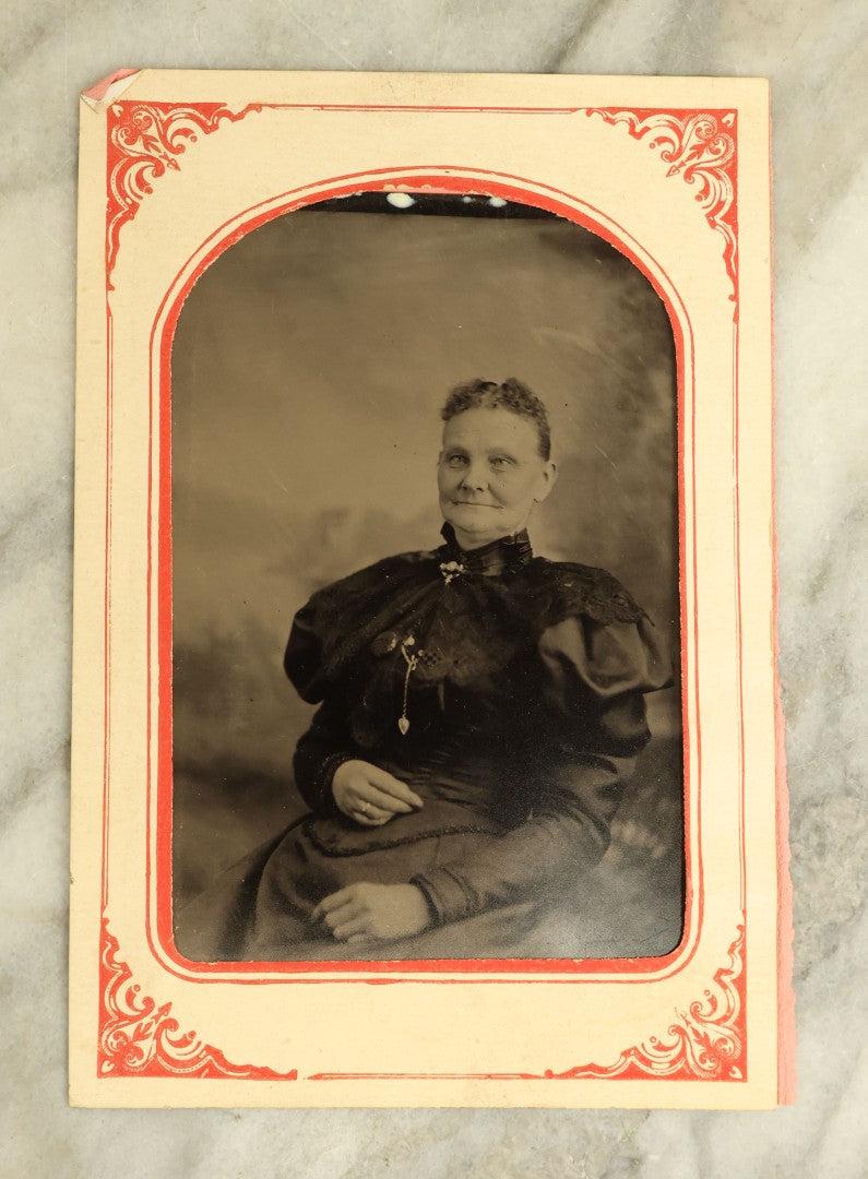 Lot 068 - Pair Of Approximately 1/4 Plate Tintype Photographs Of A Man And A Woman, In Paper Frame Mats