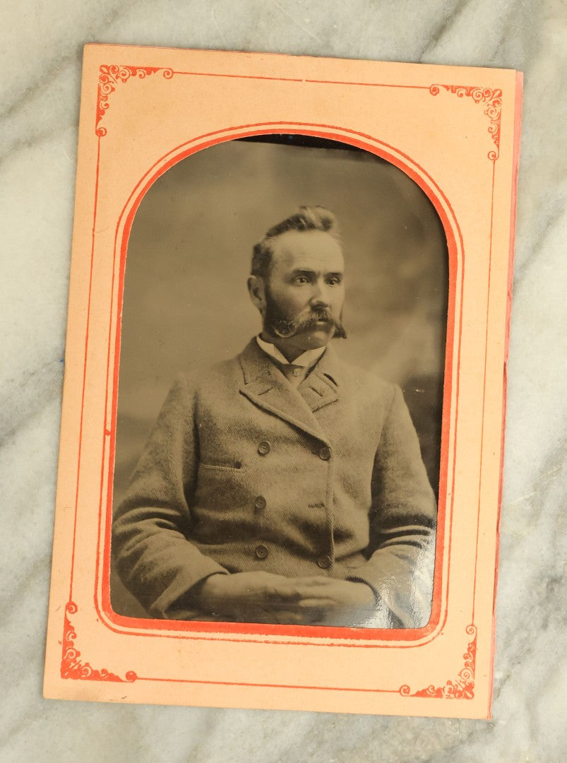 Lot 068 - Pair Of Approximately 1/4 Plate Tintype Photographs Of A Man And A Woman, In Paper Frame Mats