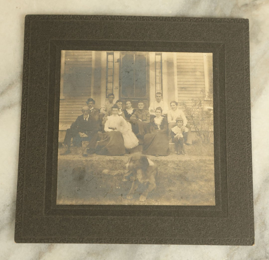 Lot 088 - Antique Boarded Group Photograph Of A Group Of People Posing In Front Of A House On The Stoop With A Dog Relaxing In The Foreground