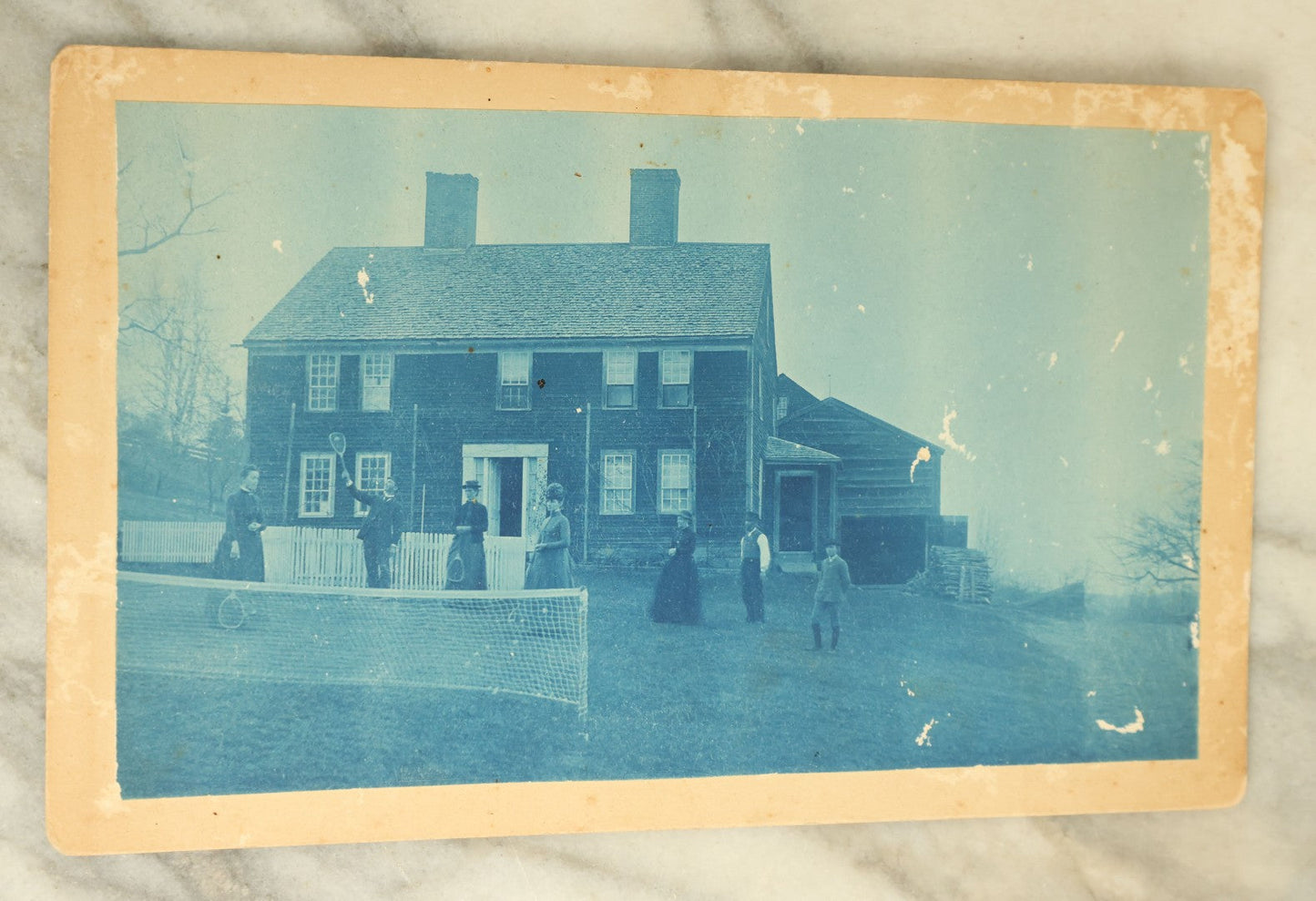 Lot 090 - Antique Boarded Cyanotype Photograph Of A Group Of Men And Women Playing Badminton In Front Of A House