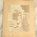 Lot 091 - Antique Boarded Photograph Of A Group Of Four People With A Little Girl And Her Two Dolls