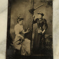 Lot 094 - Single Antique Tintype Photograph Of Two Women Posing With A Tree And Their Walking Sticks, Parasols