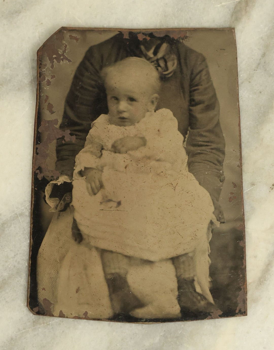 Lot 095 - Single Antique Tintype Photograph, "Not-So-Hidden Mother" With A Baby Being Held By A Mother With Head Cropped Out Of Photo