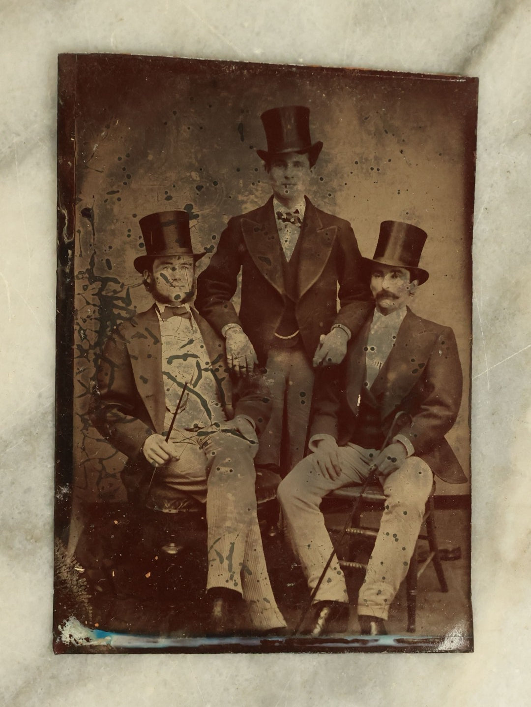 Lot 098 - Single Antique Tintype Photograph Of A Group Of Three Men In Stove Pipe Top Hats With Canes