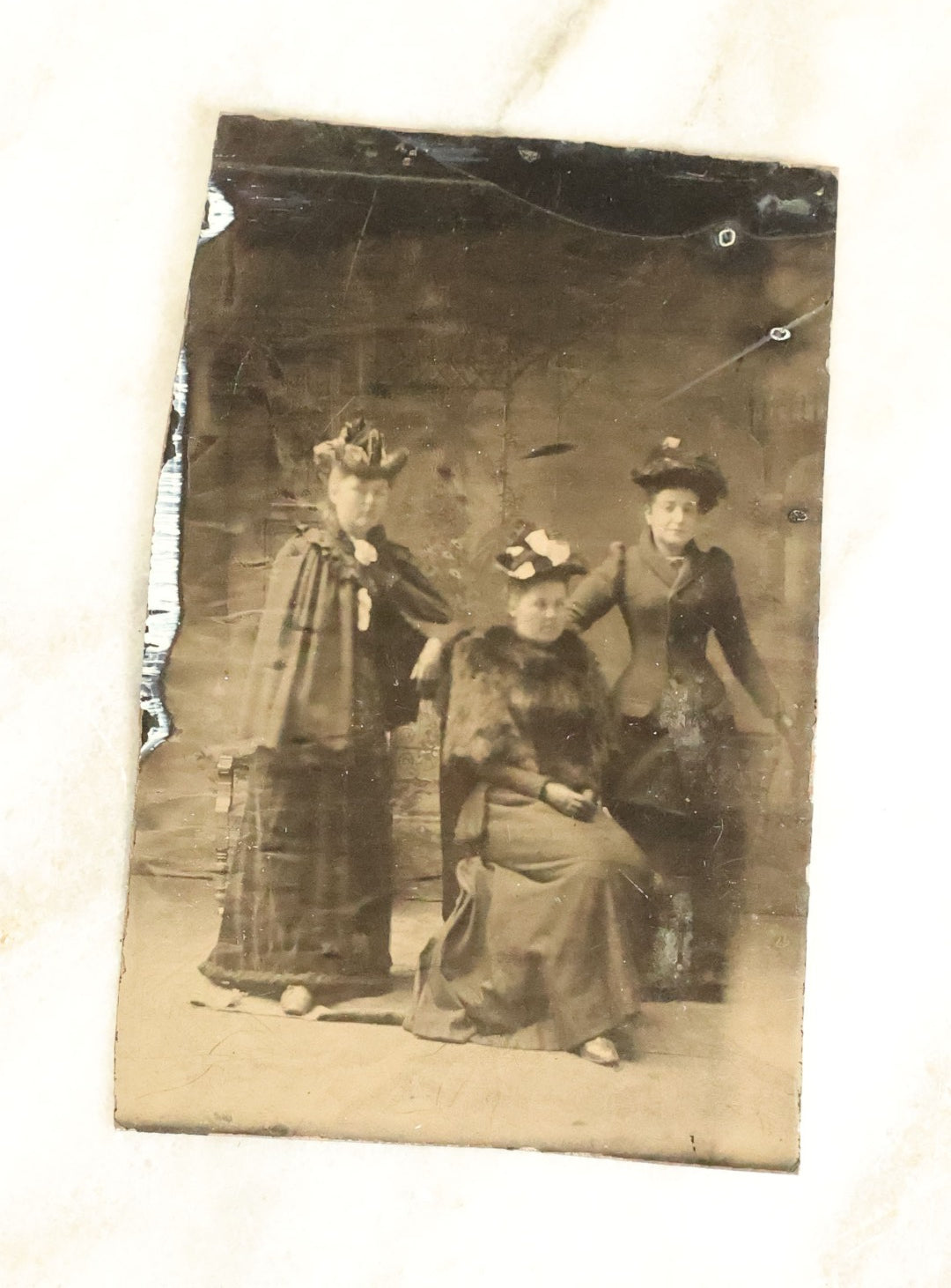 Lot 100 - Grouping Of Nine Antique Tintype Photographs, Mostly Of Groups Of Three Women, With Extravagant Dress