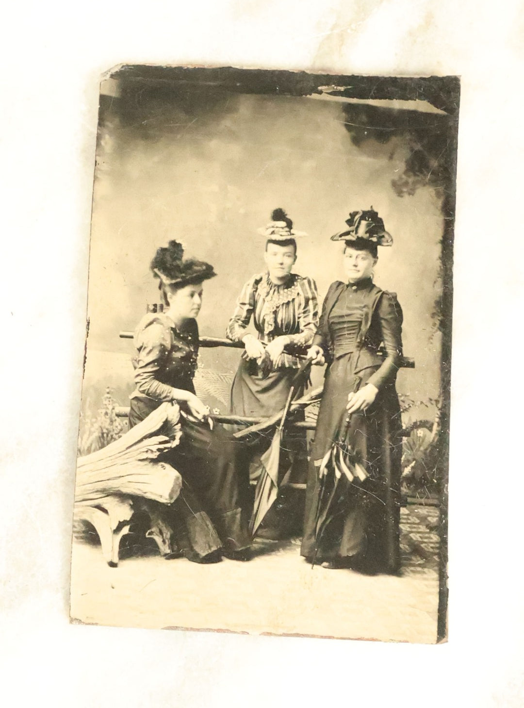 Lot 100 - Grouping Of Nine Antique Tintype Photographs, Mostly Of Groups Of Three Women, With Extravagant Dress