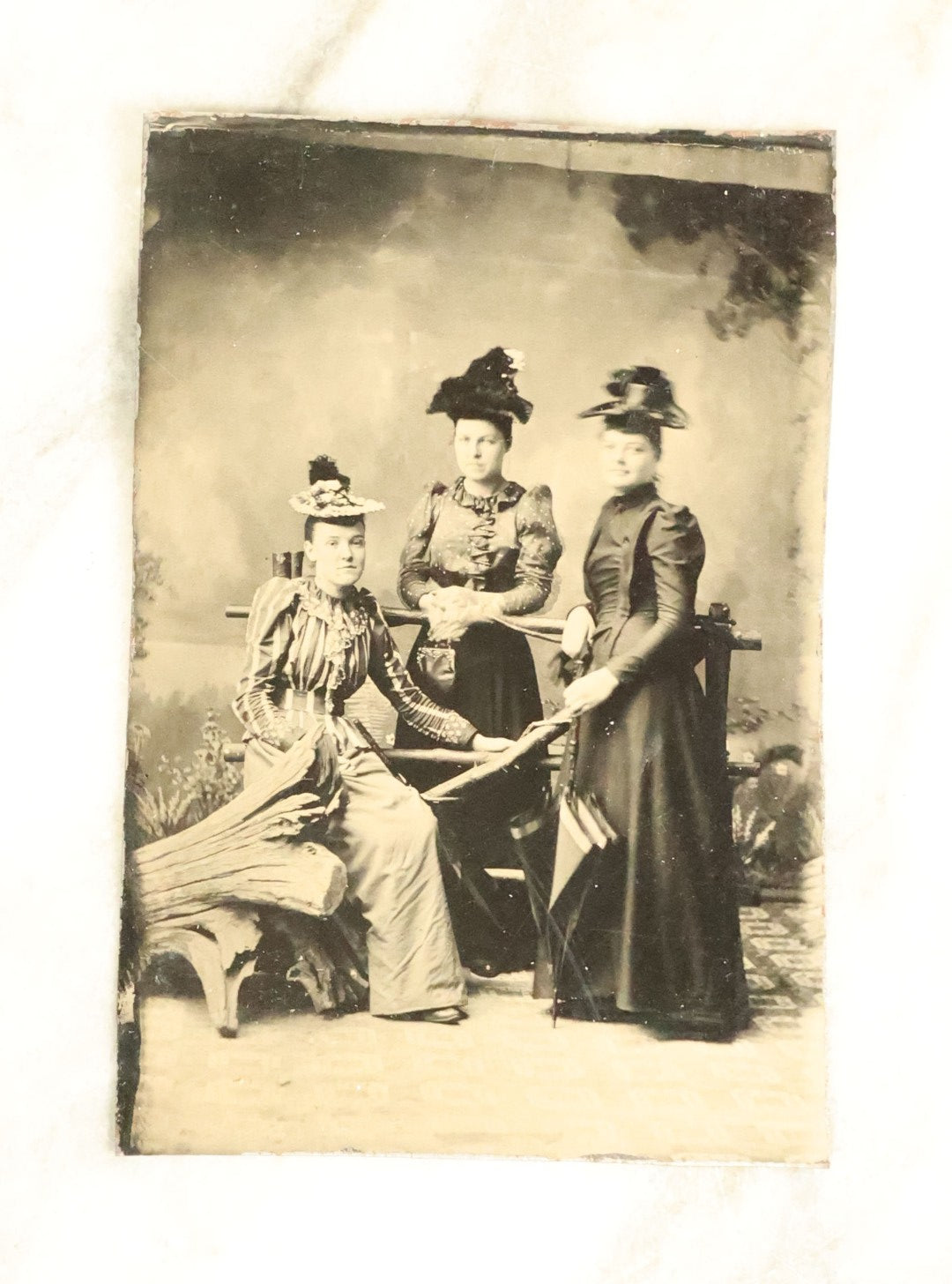 Lot 100 - Grouping Of Nine Antique Tintype Photographs, Mostly Of Groups Of Three Women, With Extravagant Dress