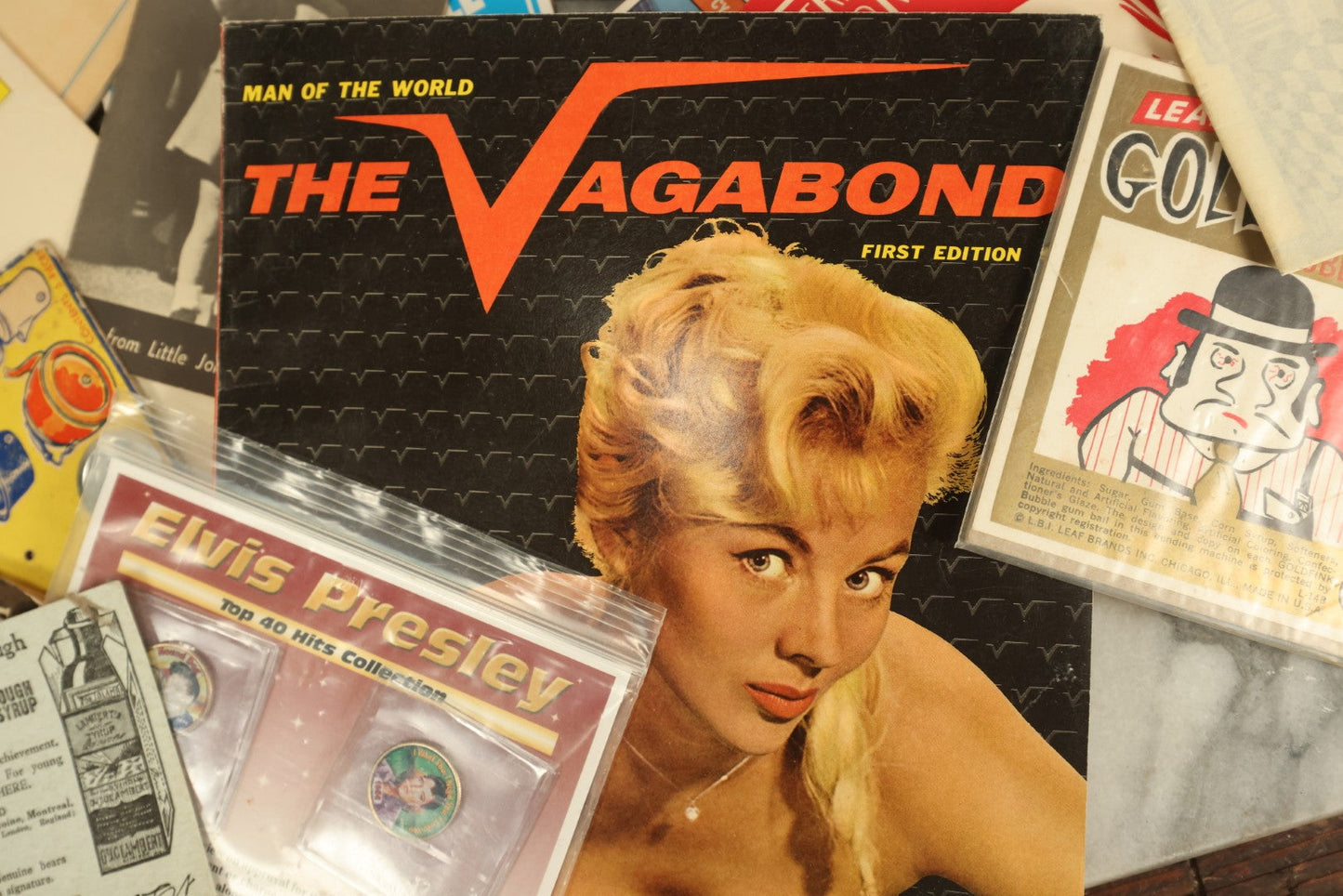 Lot 138 - Grouping Of Miscellaneous Mixed And Vintage Ephemera Including Kennedy Items, Vagabond Magazine, Elvis Presley Coins, Flash Gordon Comic, And More