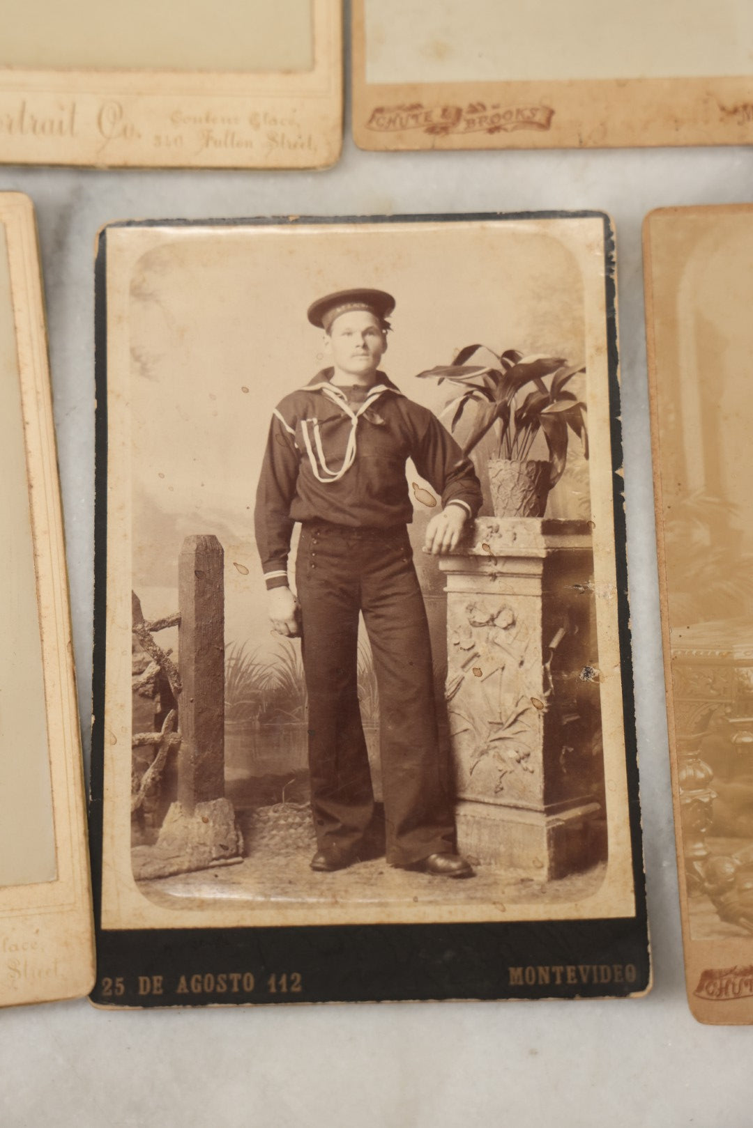 Lot 002 - Grouping Of Sixteen Antique Cabinet Card Photographs Of United States Navy Sailors Of The U.S.s Newark, Circa 1880, Photos Taken In Montevideo, Uruguay, South America