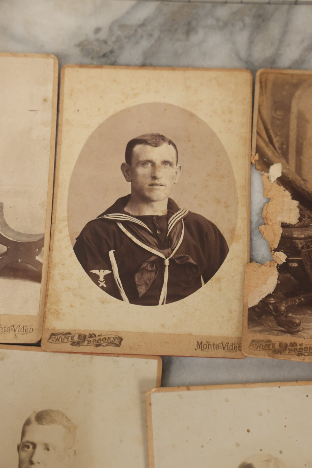 Lot 002 - Grouping Of Sixteen Antique Cabinet Card Photographs Of United States Navy Sailors Of The U.S.s Newark, Circa 1880, Photos Taken In Montevideo, Uruguay, South America