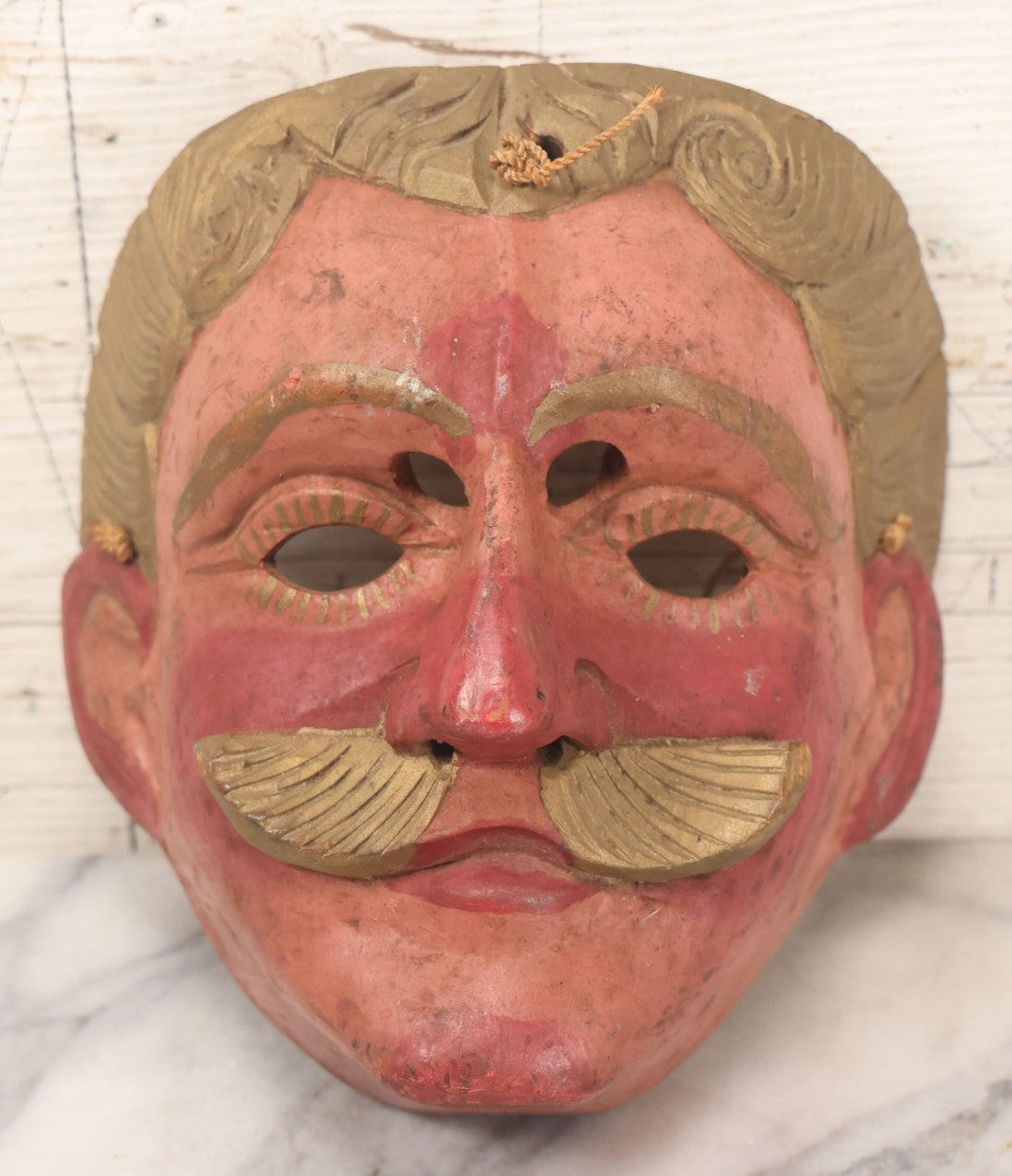 Lot 028 - Vintage Folk Art Mask Of A Blonde Man With A Blonde Mustache, Four Eye Holes, Artist Signed On Verso, With String, 20Th Century