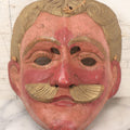 Lot 028 - Vintage Folk Art Mask Of A Blonde Man With A Blonde Mustache, Four Eye Holes, Artist Signed On Verso, With String, 20Th Century