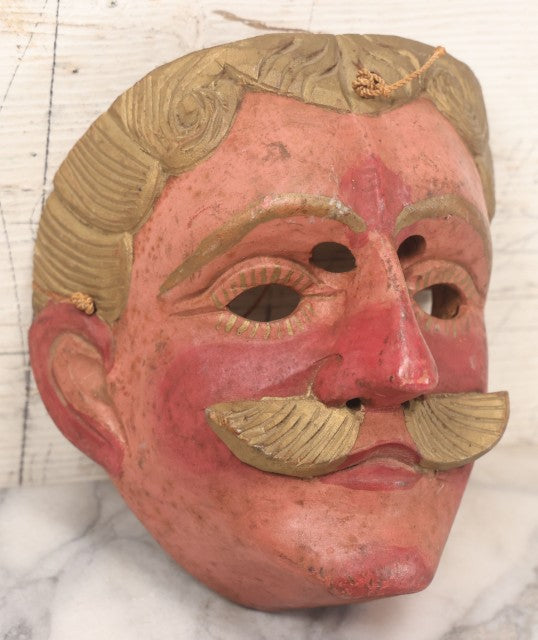 Lot 028 - Vintage Folk Art Mask Of A Blonde Man With A Blonde Mustache, Four Eye Holes, Artist Signed On Verso, With String, 20Th Century