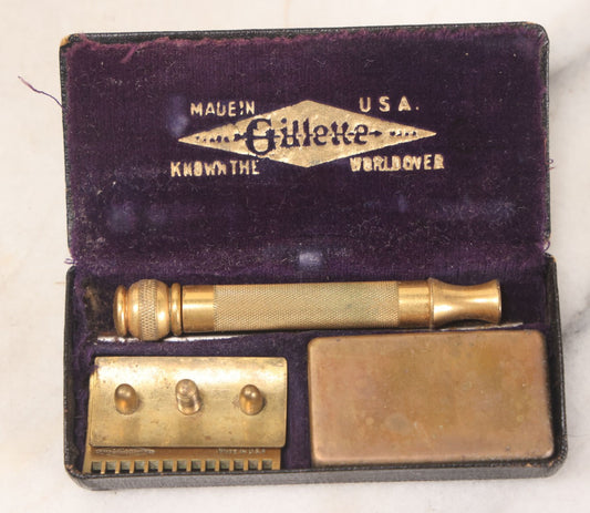 Lot 045 - Antique Brass Gillette Razor, Complete With Original Parts, Blades, In Purple Velvet Lined Carrying Case