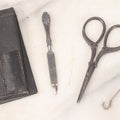 Lot 047 - Antique Sterling Silver Handled Grooming Set With Small Scissors, Button Hook, And File, In Black Leather Case, Marked Sterling, Made In U.S.A.