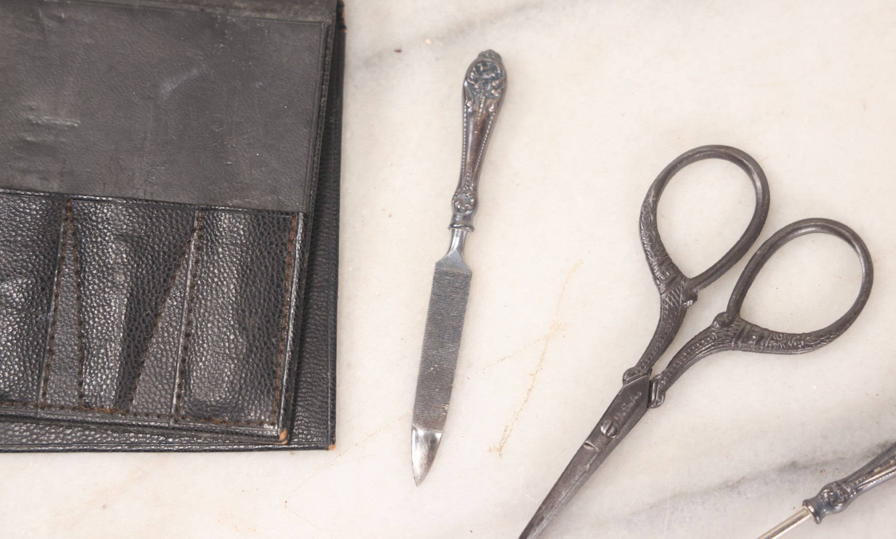 Lot 047 - Antique Sterling Silver Handled Grooming Set With Small Scissors, Button Hook, And File, In Black Leather Case, Marked Sterling, Made In U.S.A.