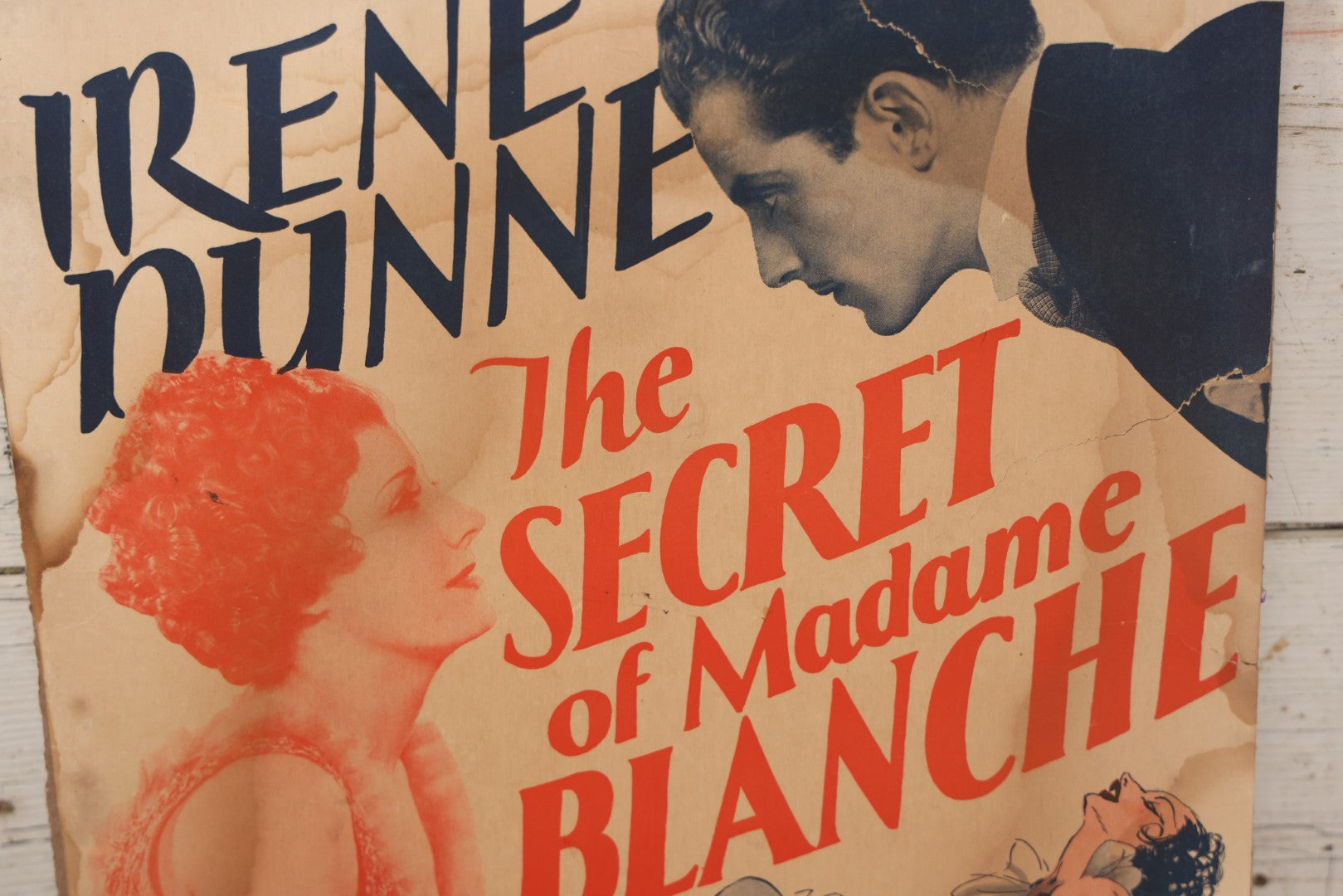 Lot 062 - Vintage Movie Poster Advertisement For Irene Dunne In "The Secret Of Madame Blanche" (1933) A Metro-Goldwyn-Mayer Picture, Affixed To Cardboard Backing, Note Losses, Wear, Tears