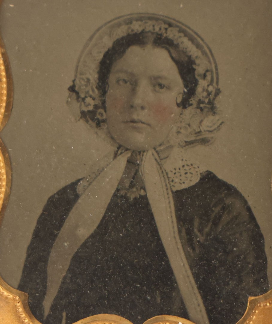 Lot 065 - Antique 1/6Th Plate Ambrotype Photograph Of A Pretty Young Woman In A Bonnet With Floral Adornments, In Split Clasp-Close Leatherette Case