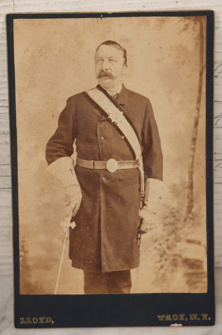 Lot 068 - Antique Cabinet Card Photograph Of An Adult Man In Freemason / Knights Templar Uniform With Sash, Sword, Belt, And Gloves, Featuring Red Cross Insignia, Etc., Lloyd Photographer, Troy, New York