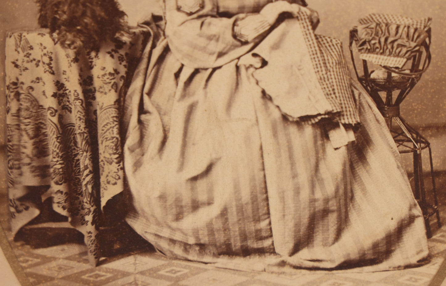 Lot 069 - Antique Matted Occupational Photograph Of An Adult Woman Seamstress, Pictured With Sewing Stand, And Scraggly Little Black Dog On Table To The Left, C.L. Obst Photographer, Pittsfield, Illinois