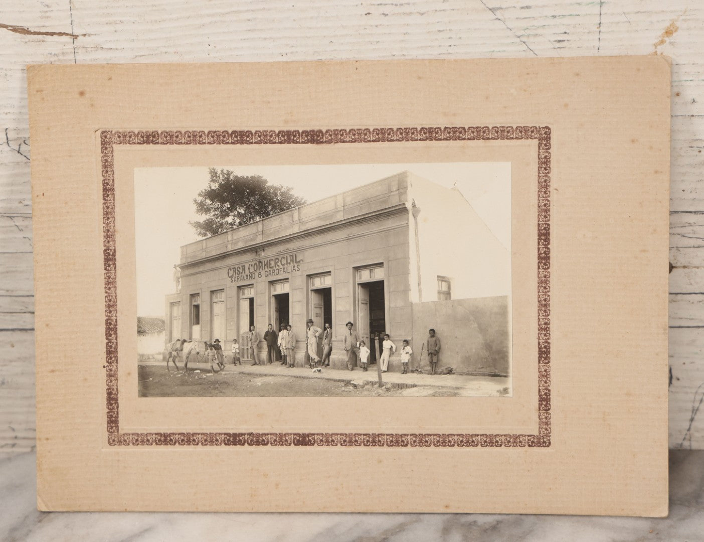 Lot 070 - Antique Mexican Or South American Boarded Photograph Of A General Store Or Like Establishment, Casa Comercial, Sarapiqui & Garofalías, With Two Dogs In Photo